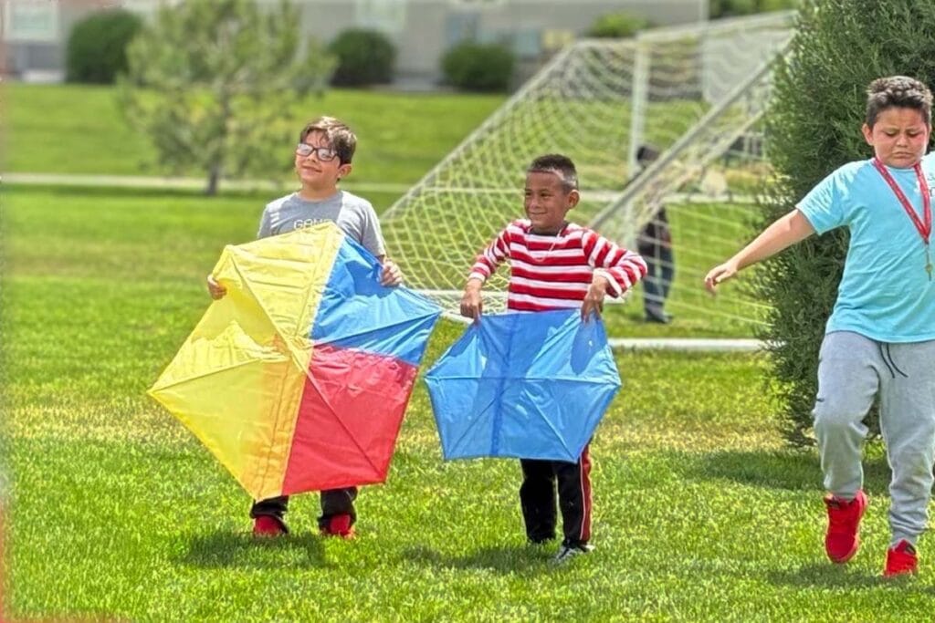 kids showing off their kites at the festival in Utah
