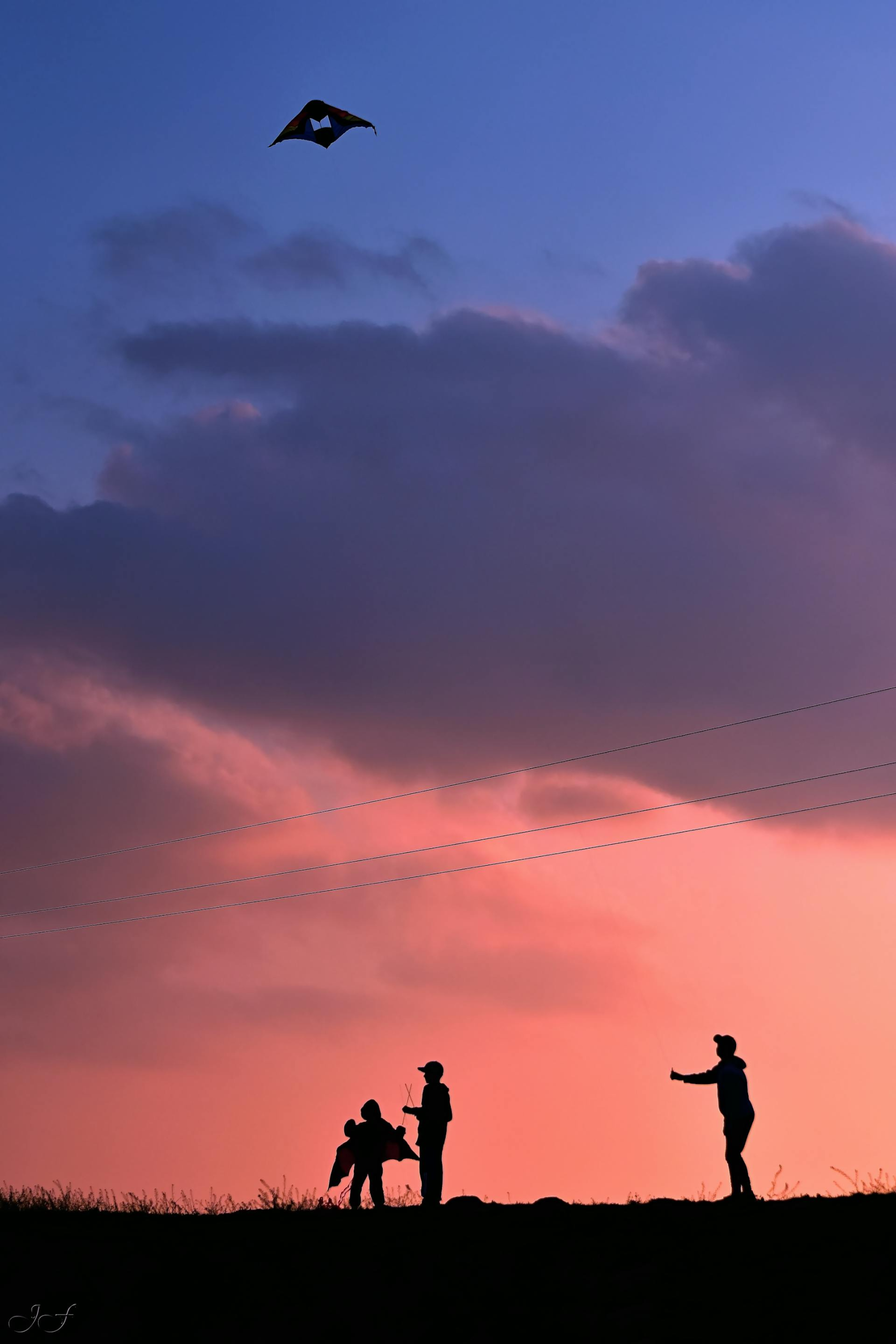 flying kites at sunset